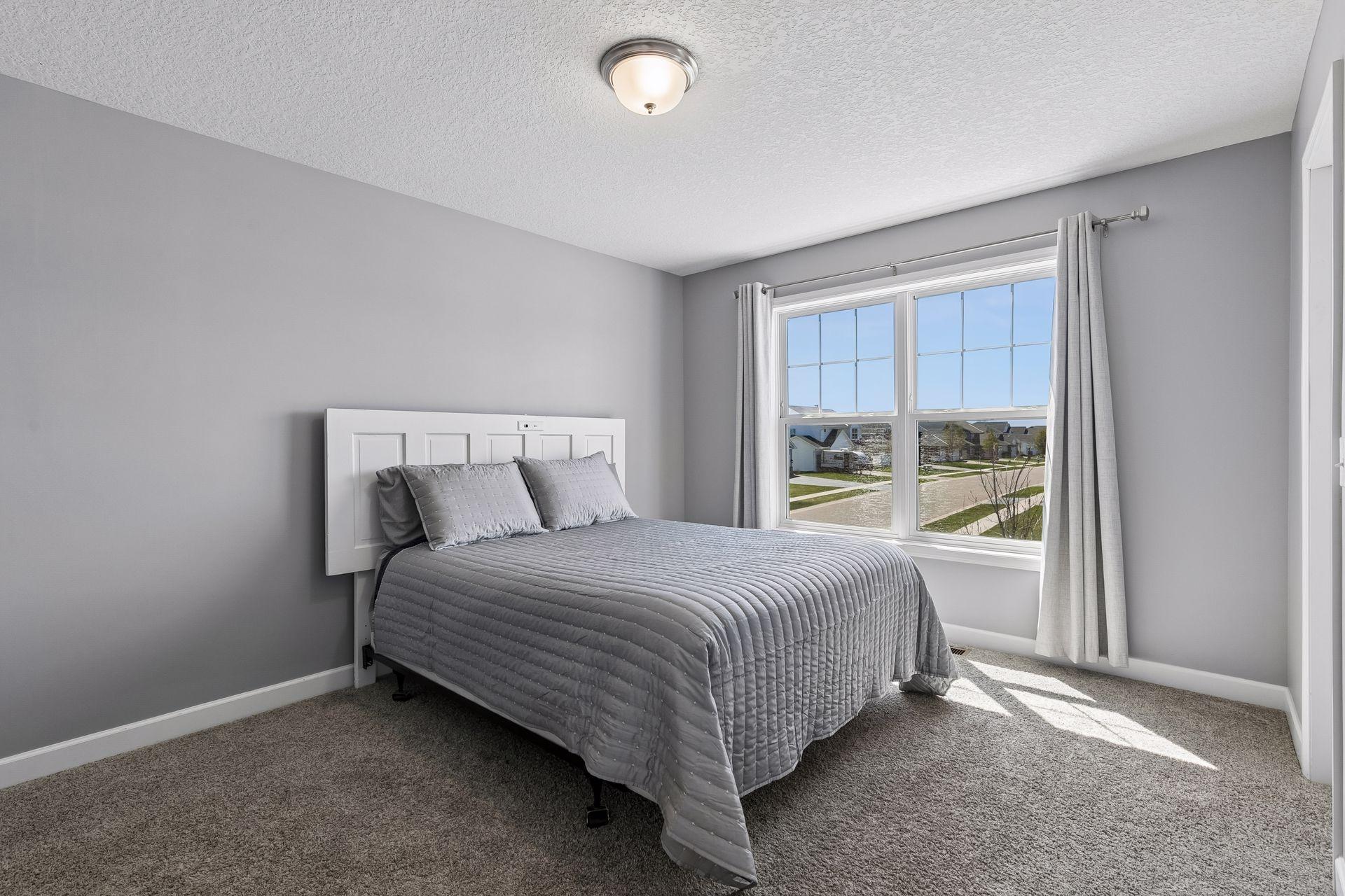 The upper level includes three additional generously sized bedrooms, besides the primary suite.