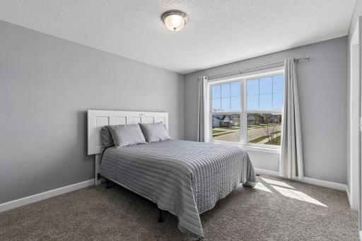 The upper level includes three additional generously sized bedrooms, besides the primary suite.