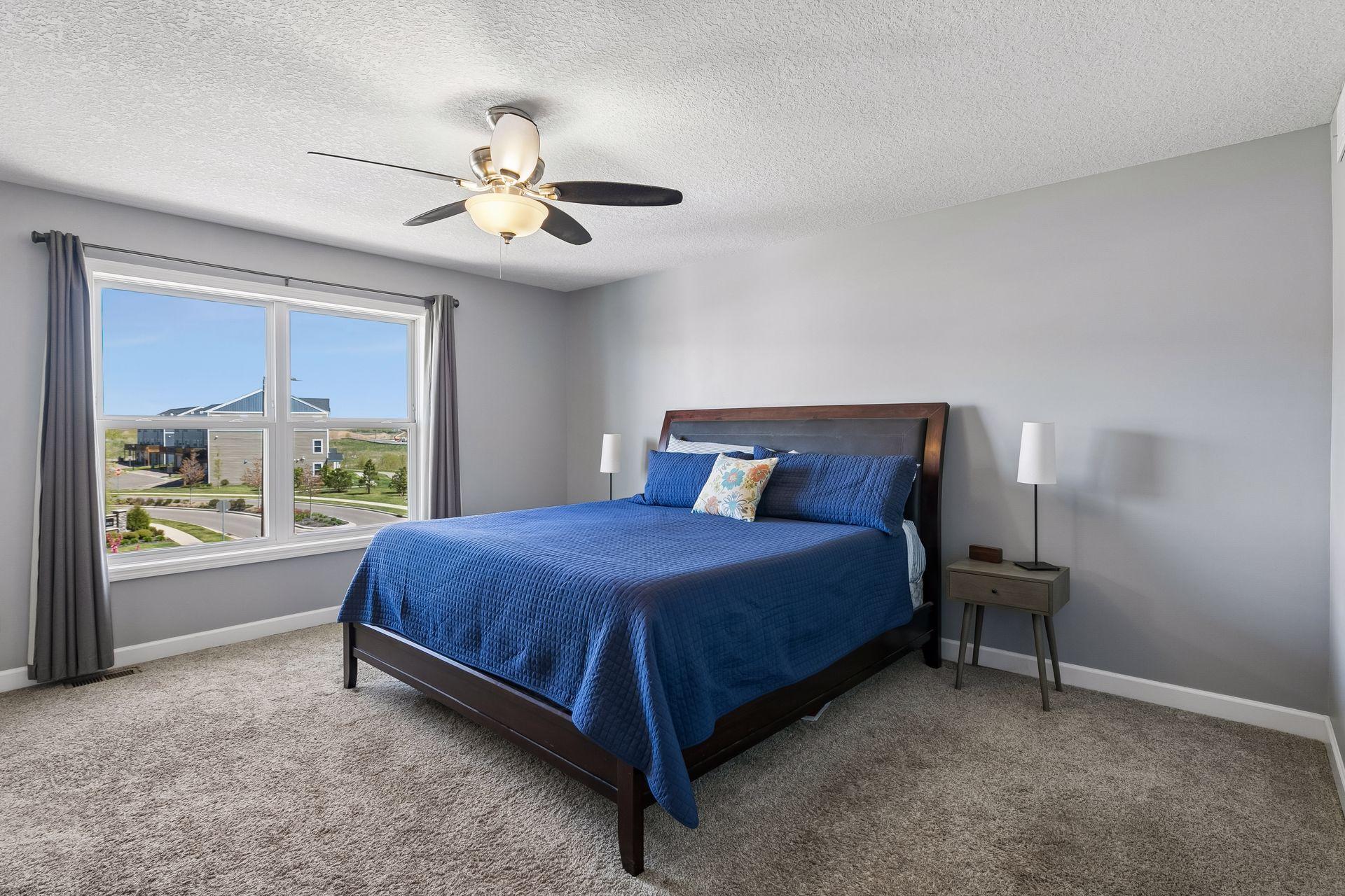 The primary suite includes a walk-in closet and spa-inspired bathroom featuring dual vanities and a large tiled shower.