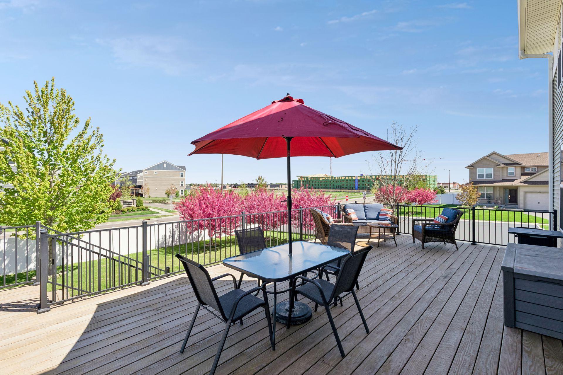 Step outside to an expansive deck overlooking the private fenced-in backyard, complete with a relaxing hot tub.