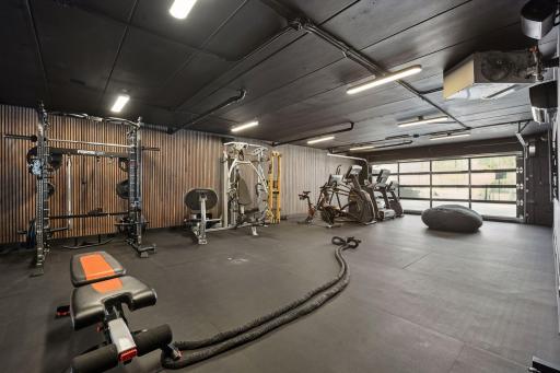 The most impressive addition to this home is a CrossFit-style gym with a new garage door, rubber gym flooring, finished walls, vapor and humidity protection, dedicated air conditioning and heat, and state-of-the-art audio-visual equipment.
