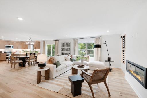 Open concept kitchen, dining, and family room with 9' ceilings make the space feel bright and open.