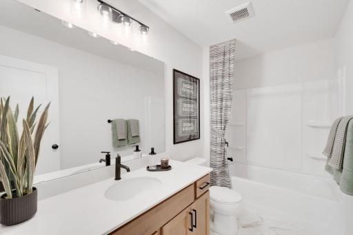 Upper level full bath shared by the 3 secondary bedrooms