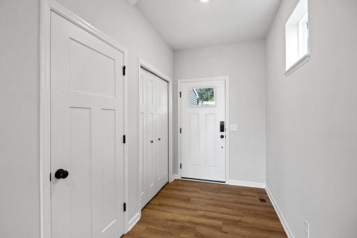 Front entryway with coat closet and door to lookout basement!