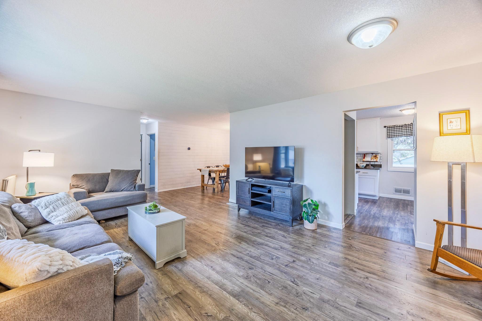 Open concept living room leading to kitchen and dining room!