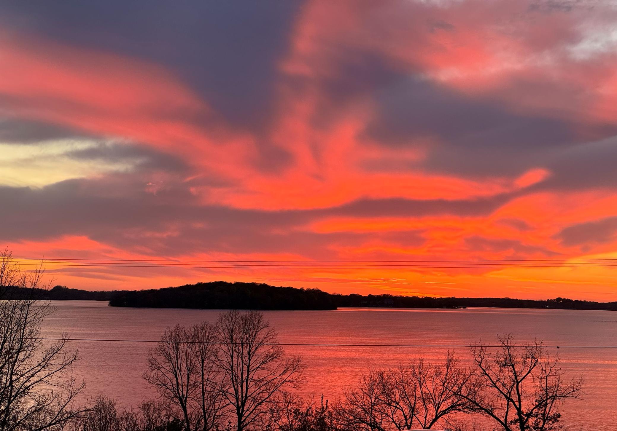 Beautiful sunset with a view of Coney Island. The island is a quick boat ride away and has docks for public use, walking trails and picnic areas.