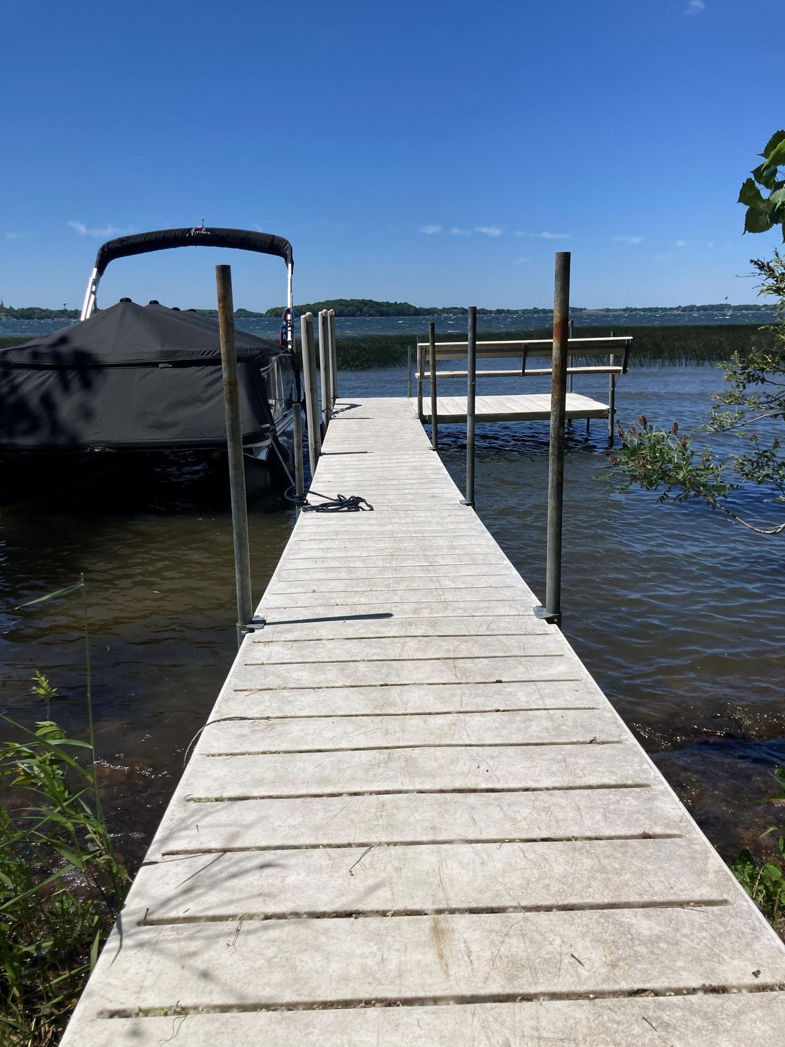 The dock is included in the sale of the home. Note the attached bench at the end of the dock.