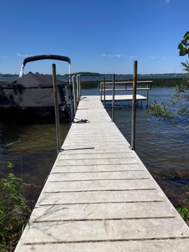 The dock is included in the sale of the home. Note the attached bench at the end of the dock.