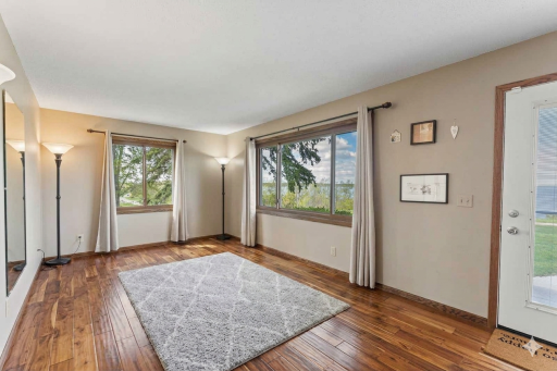 The Pilates equipment was virtually removed so you can see how spacious the room is. The acacia flooring was installed in 2017 and runs throughout the main floor.