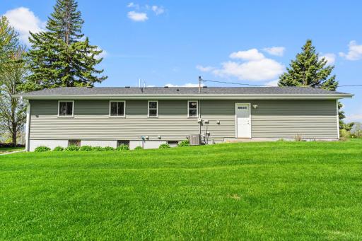 There is a large backyard. Not in the picture is a doghouse surrounded by a chain link fence.
