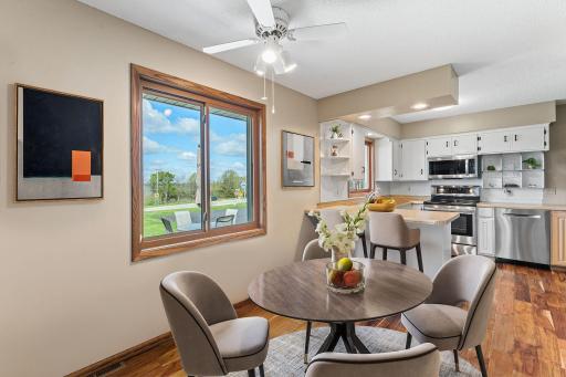 The informal dining room is virtually staged. There is plenty of room for an even larger dining room table.