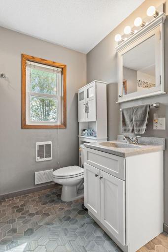 2nd vanity and sink in the original bathroom. Please note the new tile floor.