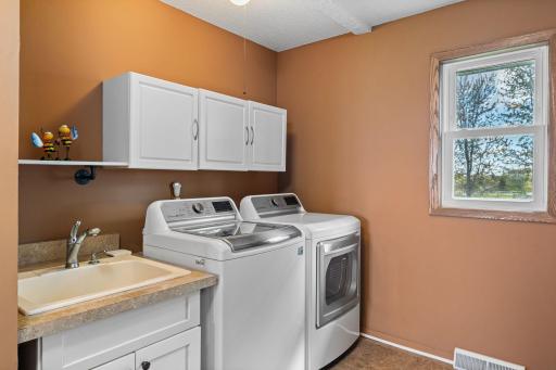 Main floor laundry and mud room are just off the garage for convenience and one level living.