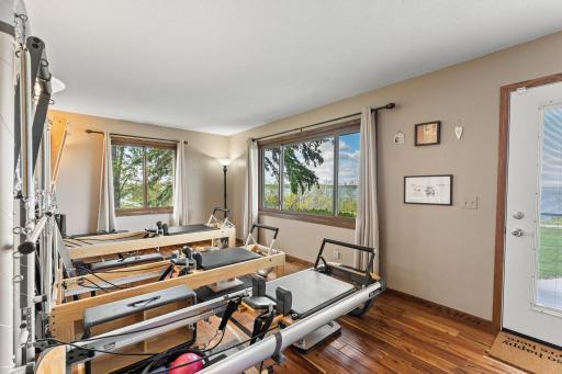 The owner runs a Pilates business from the home. The new front door has a blind built-in between the panes of glass for total privacy or a clear view of the lake.