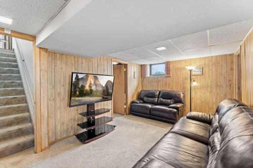 The flex room and additional family room space is on the left side of the stairs. The flex room is perfect for a workshop, craft room, office or whatever you need. The door leads to the half bath.