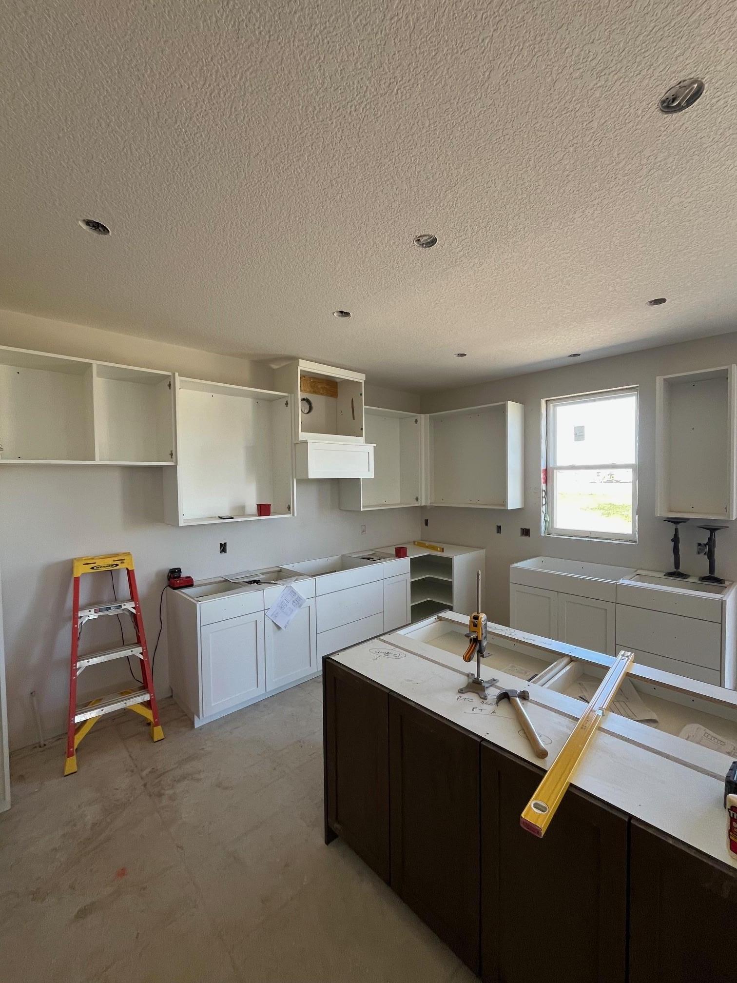 Current stage of home, cabinet install