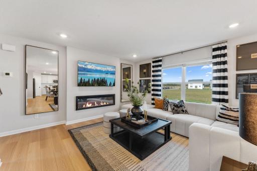 The family room is anchored around a low maintenance electric fireplace that keeps the room feeling very open. Bonus is that you can use the fireplace with or without heat! Outlet is already in place to hang a TV over the fireplace!