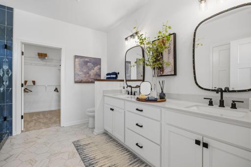 Owner's Bathroom- two sink vanity and tiled shower