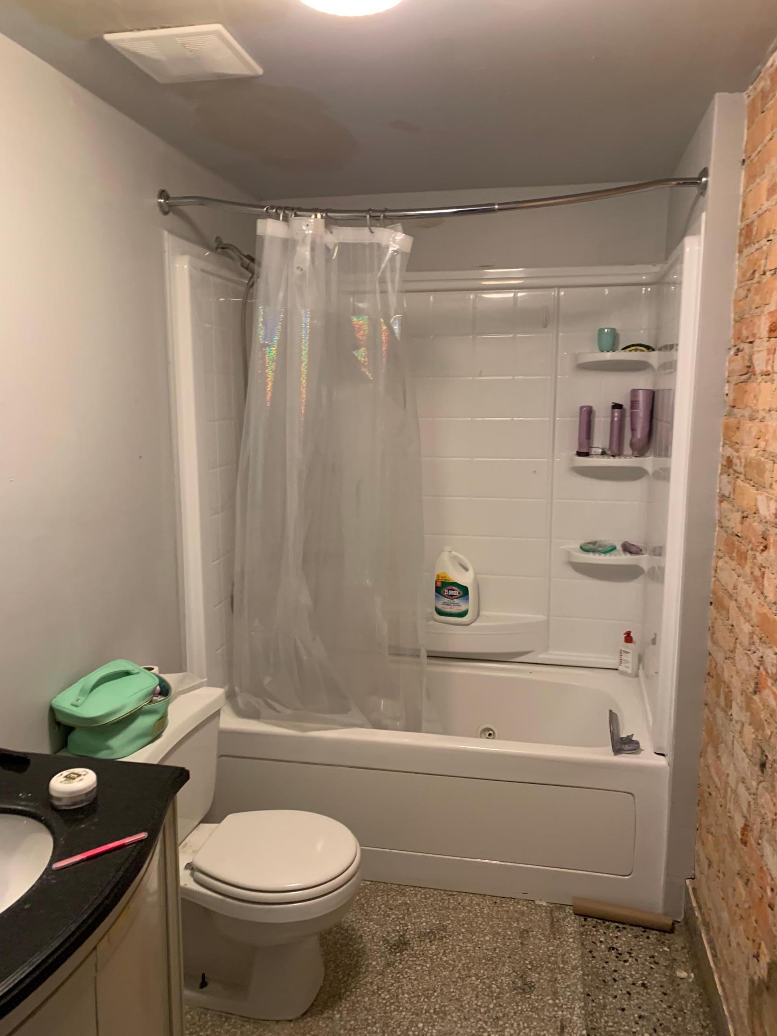 Full Bath with exposed brick