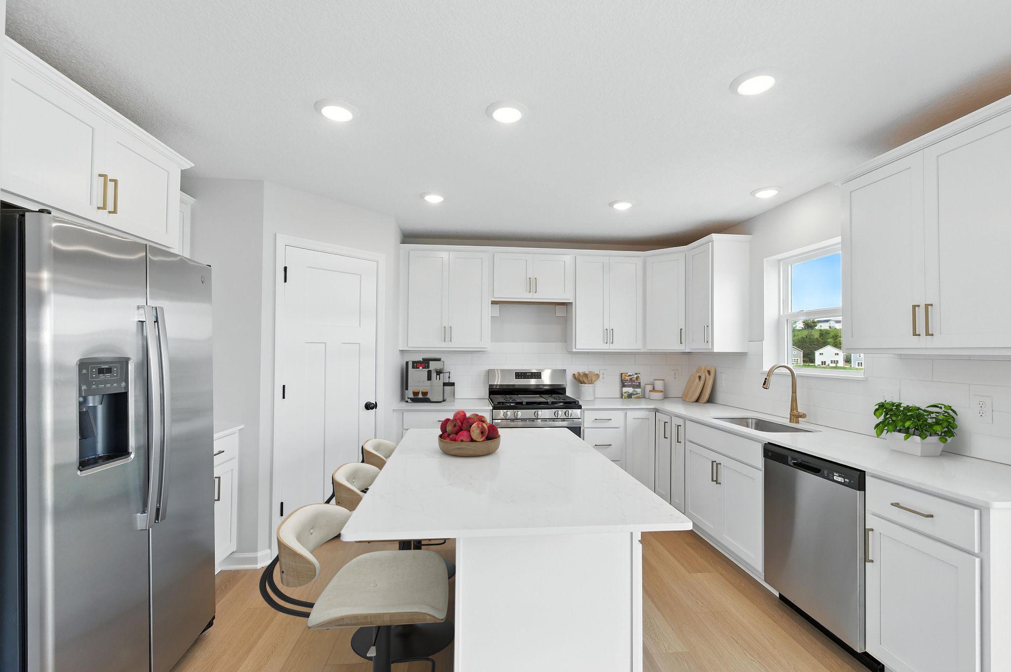 Kitchen - Pictures from previously build plan to showcase space. See agent for specific selections.
