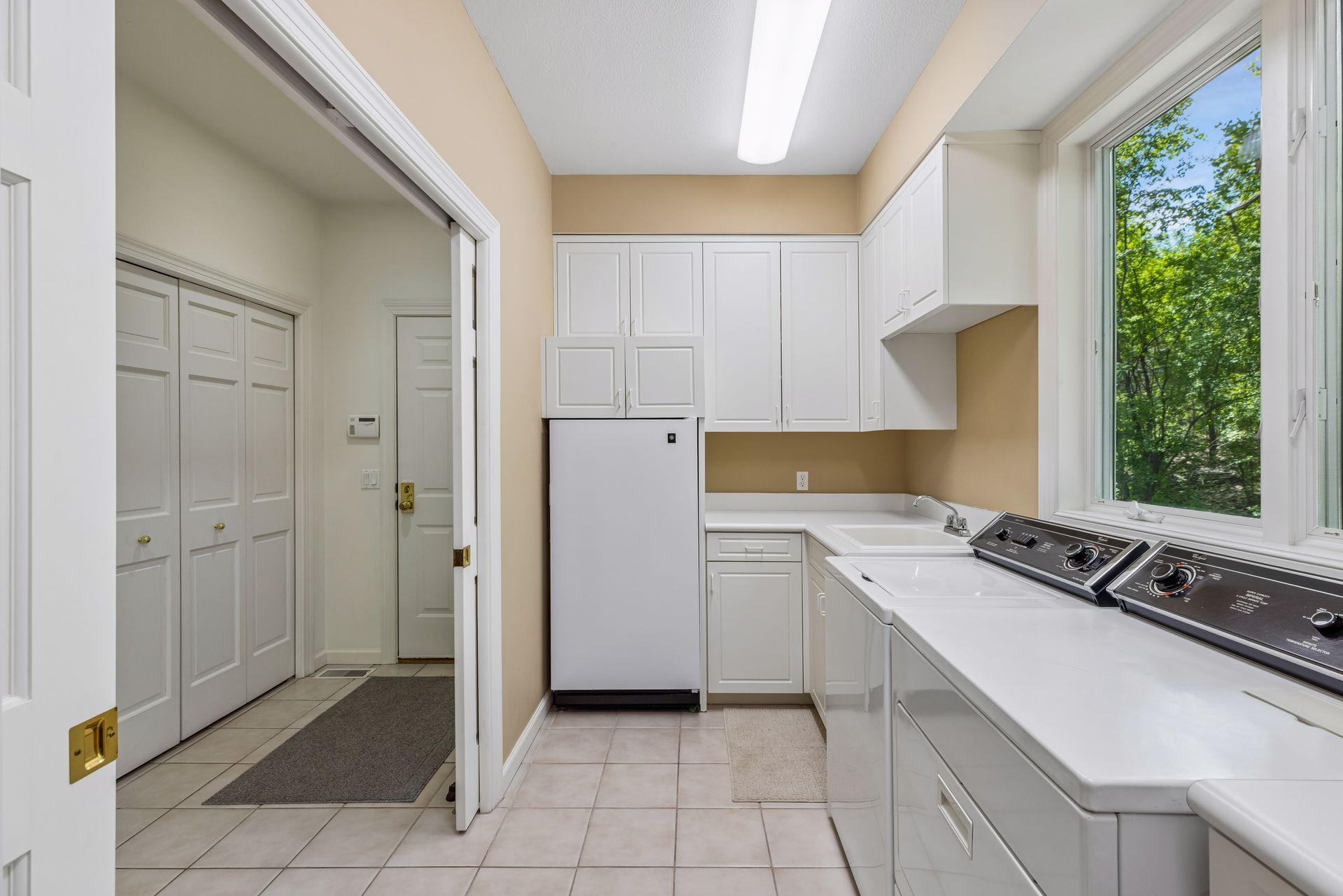 Main level laundry room with extra refridge