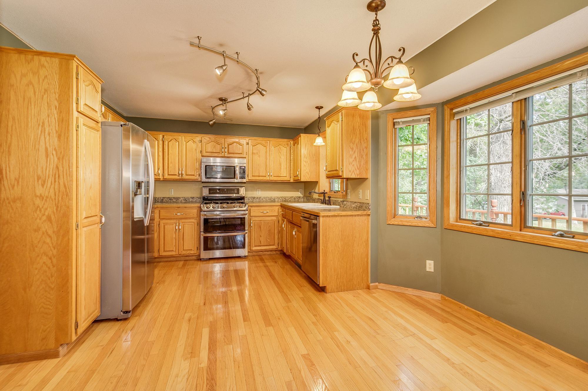 Kitchen offers a eat in or dining area with a walkout to the upper deck to enjoy dinner & quite evening.