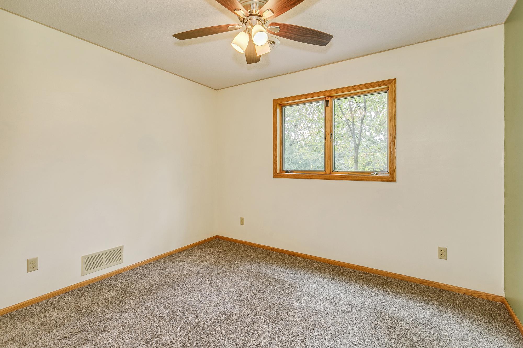 Main Floor 4th Bedroom with New carpet and ceiling fan