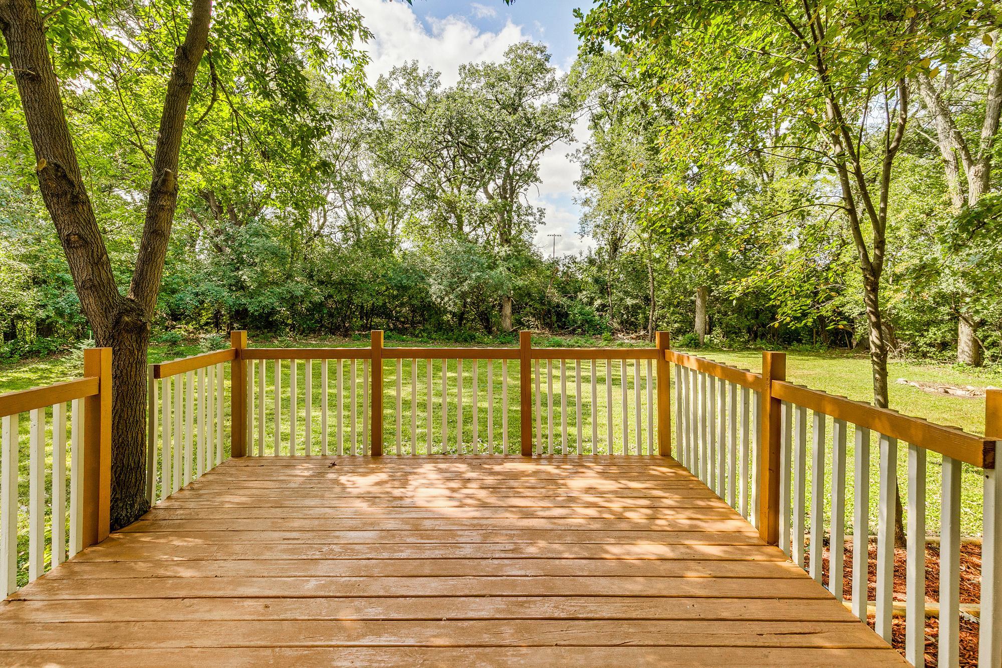 Main LARGE Deck to the private peaceful back yard. Enjoy entertaining, BBQ's, soaking up nature or watching the kids & pets play!