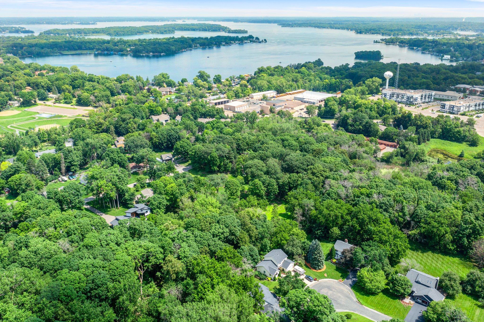 This 1.8-acre property offers exceptional flexibility and investment potential. Nestled on a level, fully fenced lot just minutes from the Lake Minnetonka LRT Trail and vibrant downtown Excelsior.