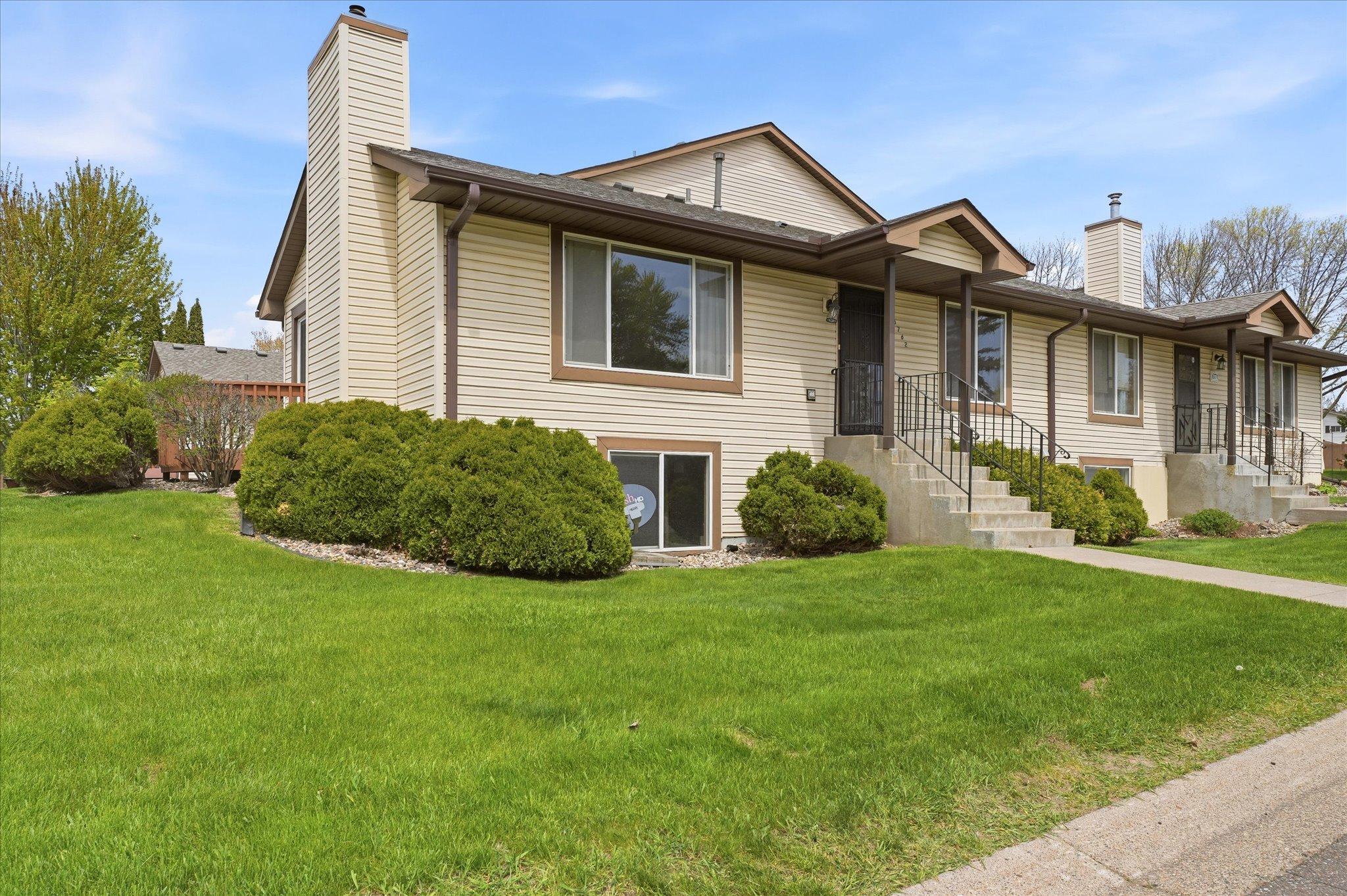 Spacious corner location offers added privacy, extra green space, and abundant natural light throughout the home.