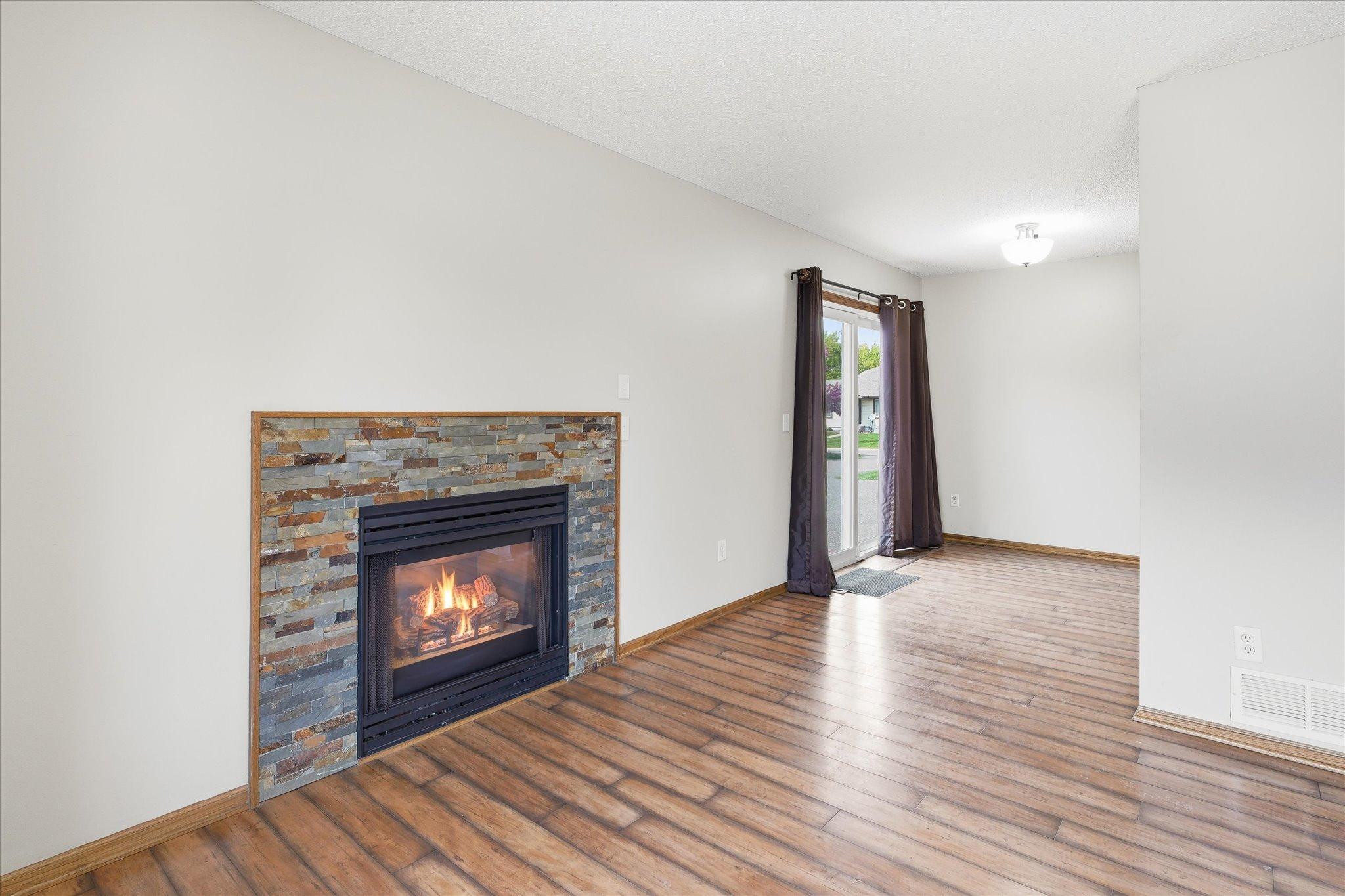 Open-concept layout seamlessly connects the living room, dining area, and kitchen for easy entertaining.