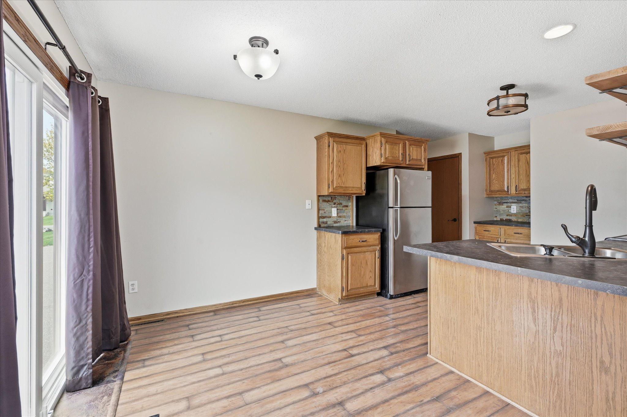 Dining area with sliding glass door provides easy access to the outdoor deck and brings in great natural light.