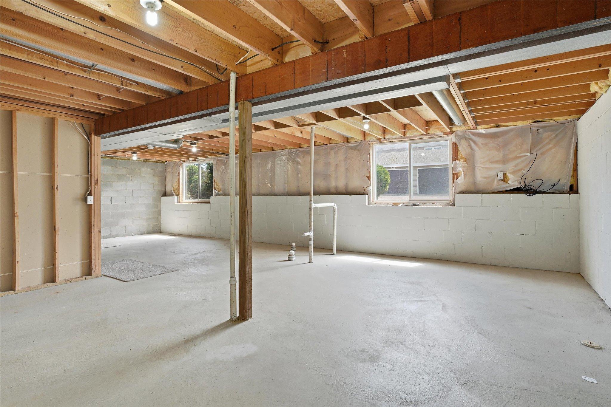 Expansive lower level offers excellent potential for a future family room, workout area, or additional bedrooms.