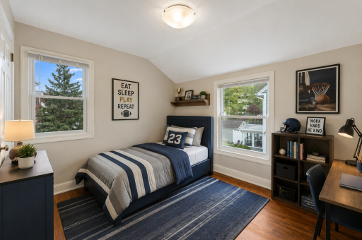 Sporty teen bedroom with modern touches.png