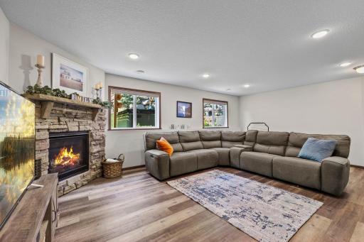 Lower level family room with gas burning fireplace