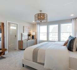 Huge windows and ample space make the Ashton Primary Bedroom one to remember! Photo of model home.
