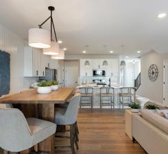 Conveniently located off the kitchen we find the dining room! Perfectly sized to accommodate any table or set up you could want! Photo of model home.