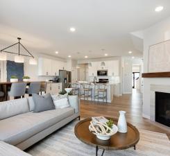 Come over to the living room perfect for any occasion! Both spacious and luxurious, this living room is perfect for any occasion! Photo of model home.