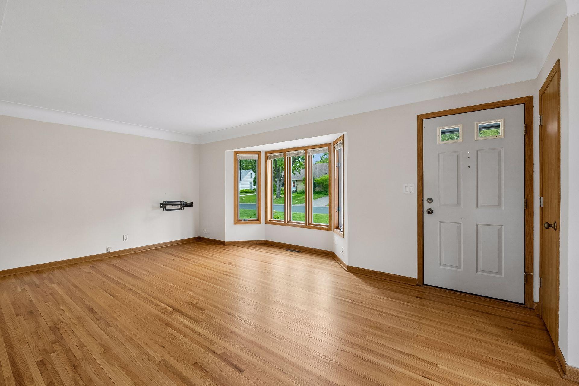 Large living room with recently refinished hardwood floors