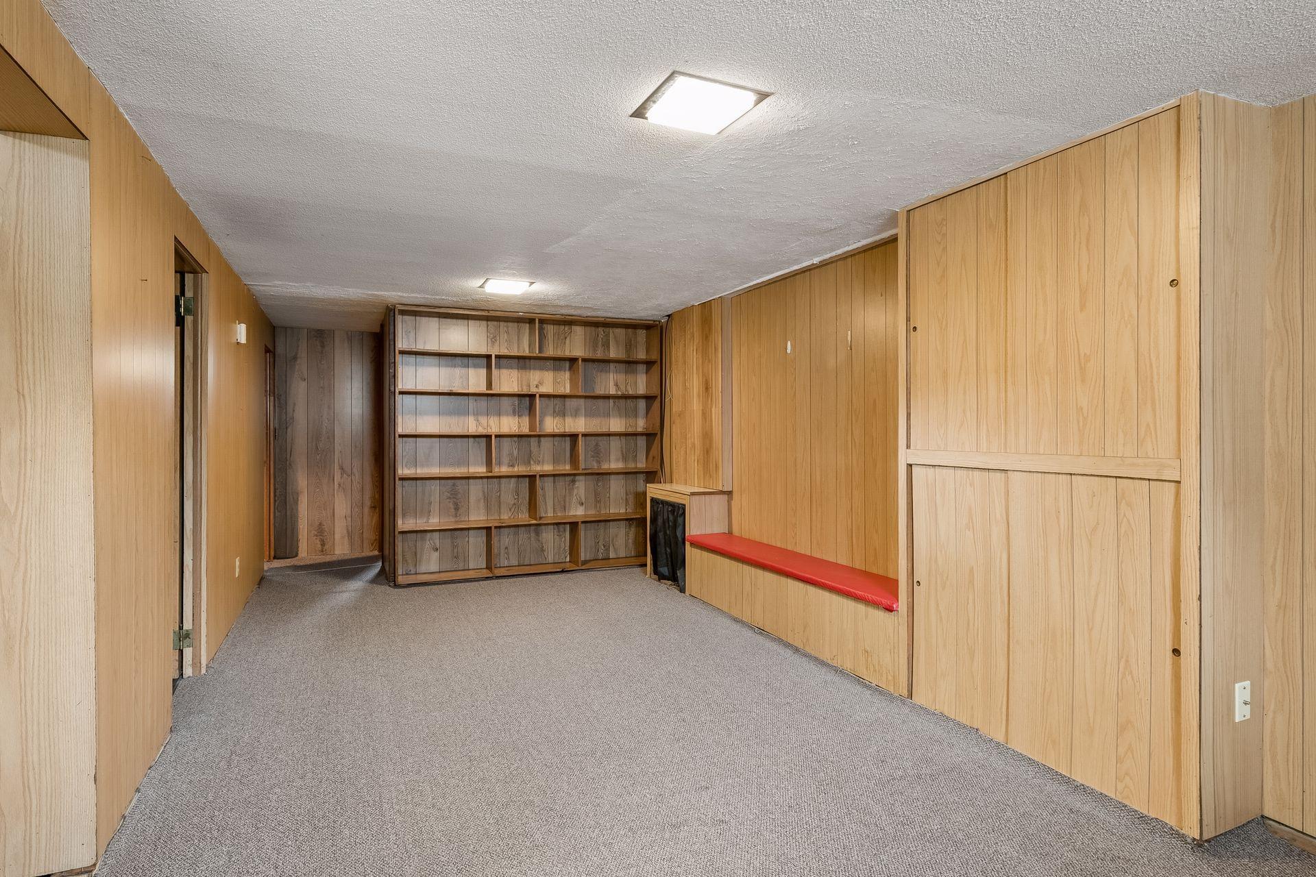Large family room has lots of built-in shelving