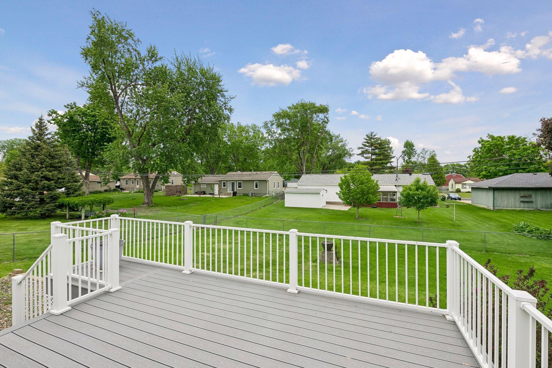 New maintenance free deck with two sets of stairs to the flat yard