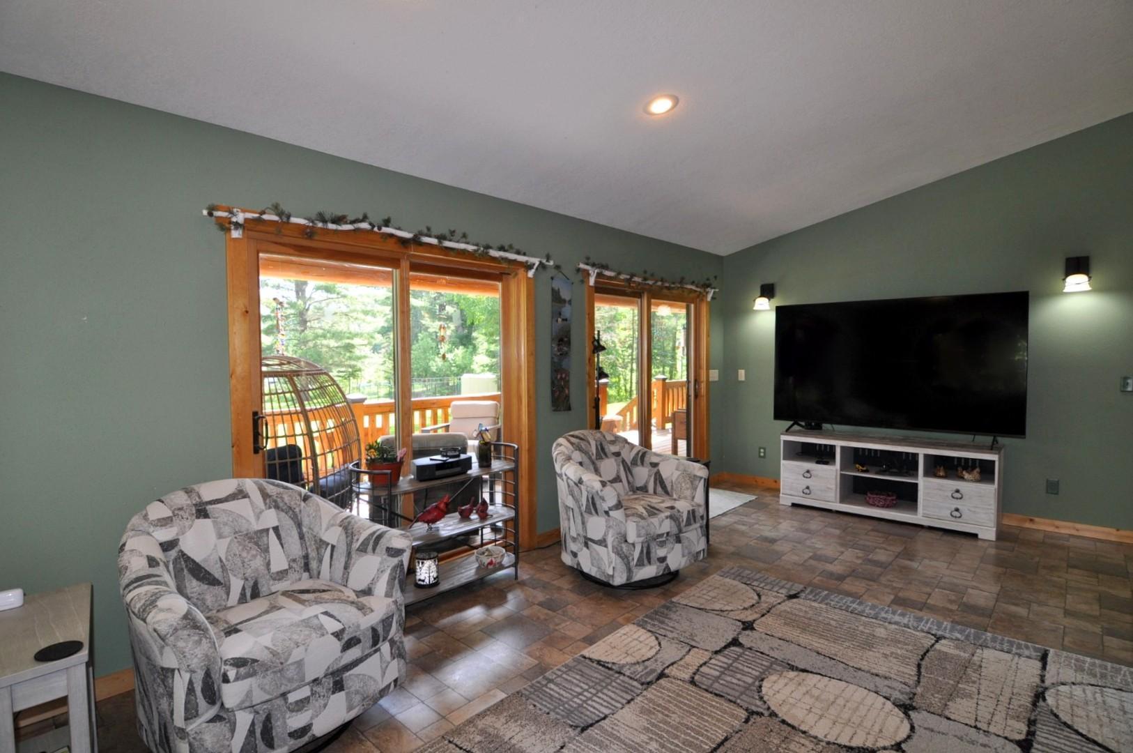2 sliding glass doors lead to spacious covered porch