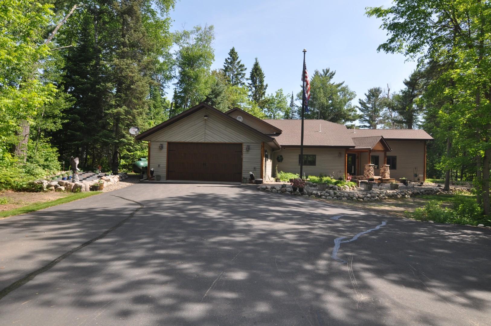 Paved Driveway leads to attached garage