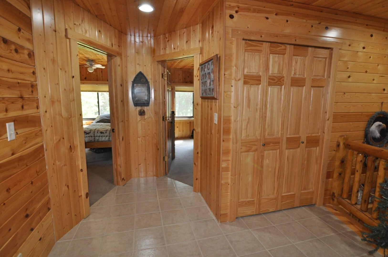 Upper level offers 2 bedrooms with views of the lake, hall closet and 3/4 bath