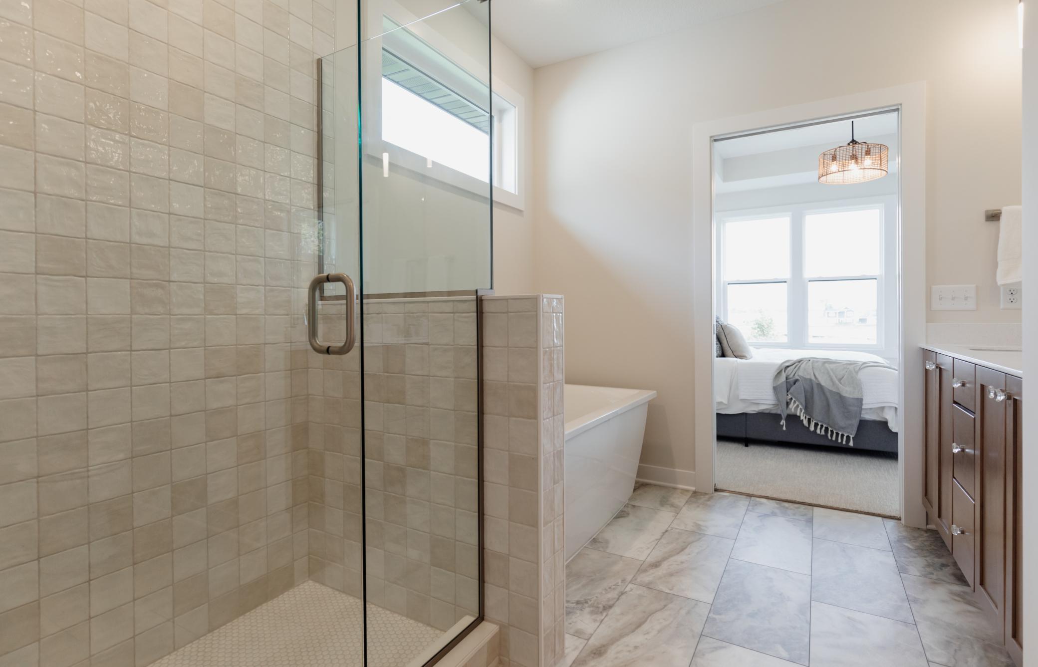 The primary bedroom ensuite. *Photo of similar home with the same layout.