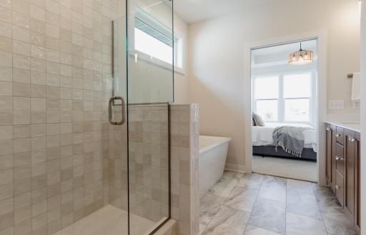 The primary bedroom ensuite. *Photo of similar home with the same layout.