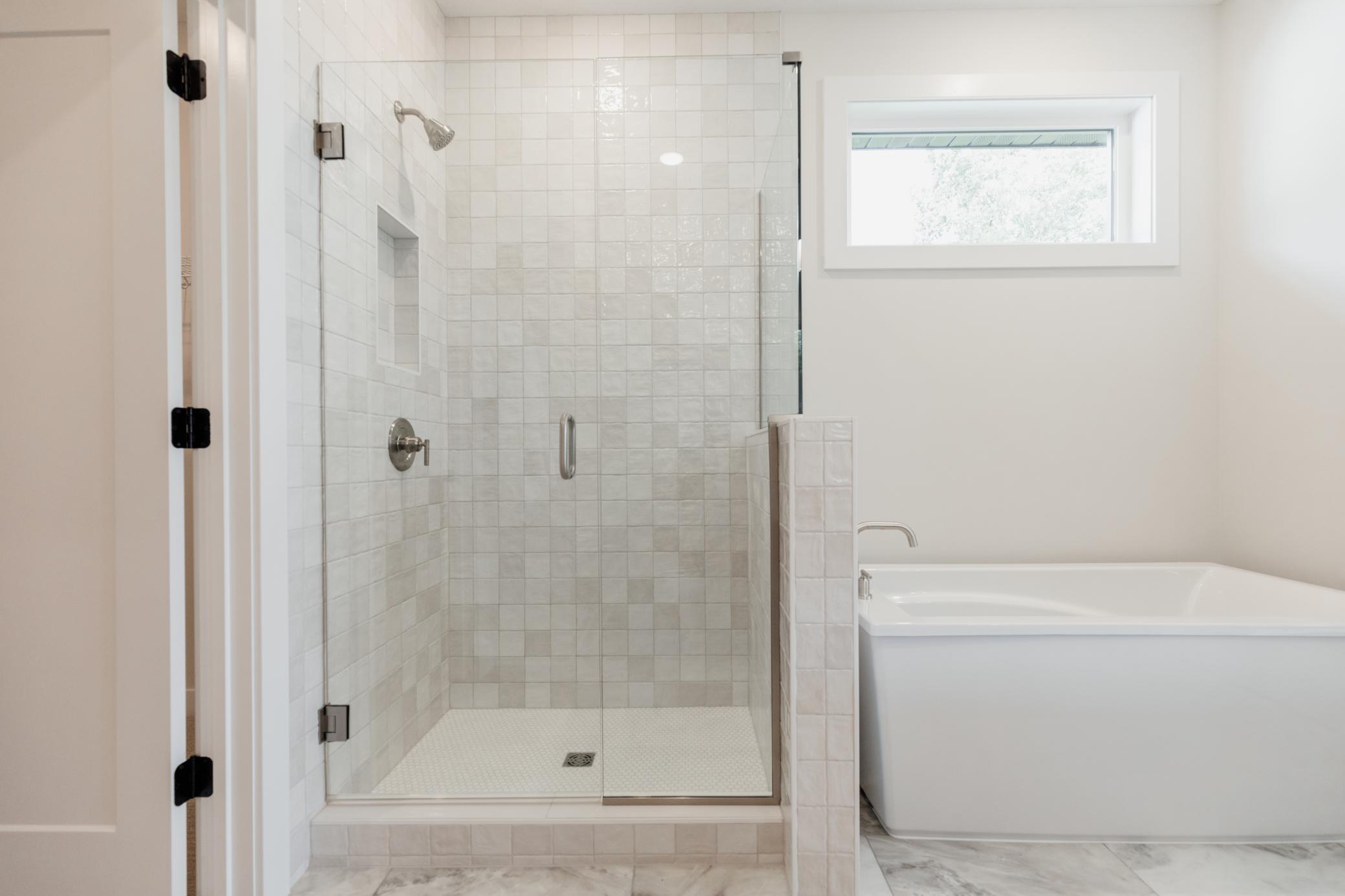 The primary bedroom ensuite. *Photo of similar home with the same layout.