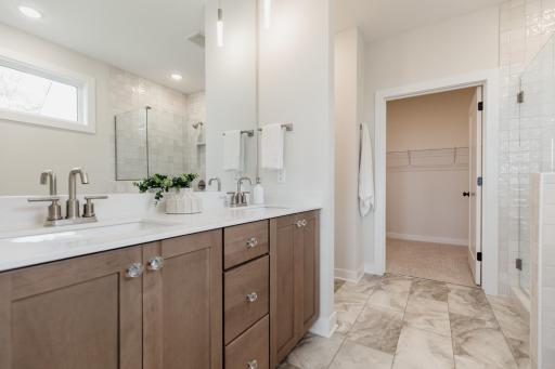 The primary bedroom ensuite. *Photo of similar home with the same layout.