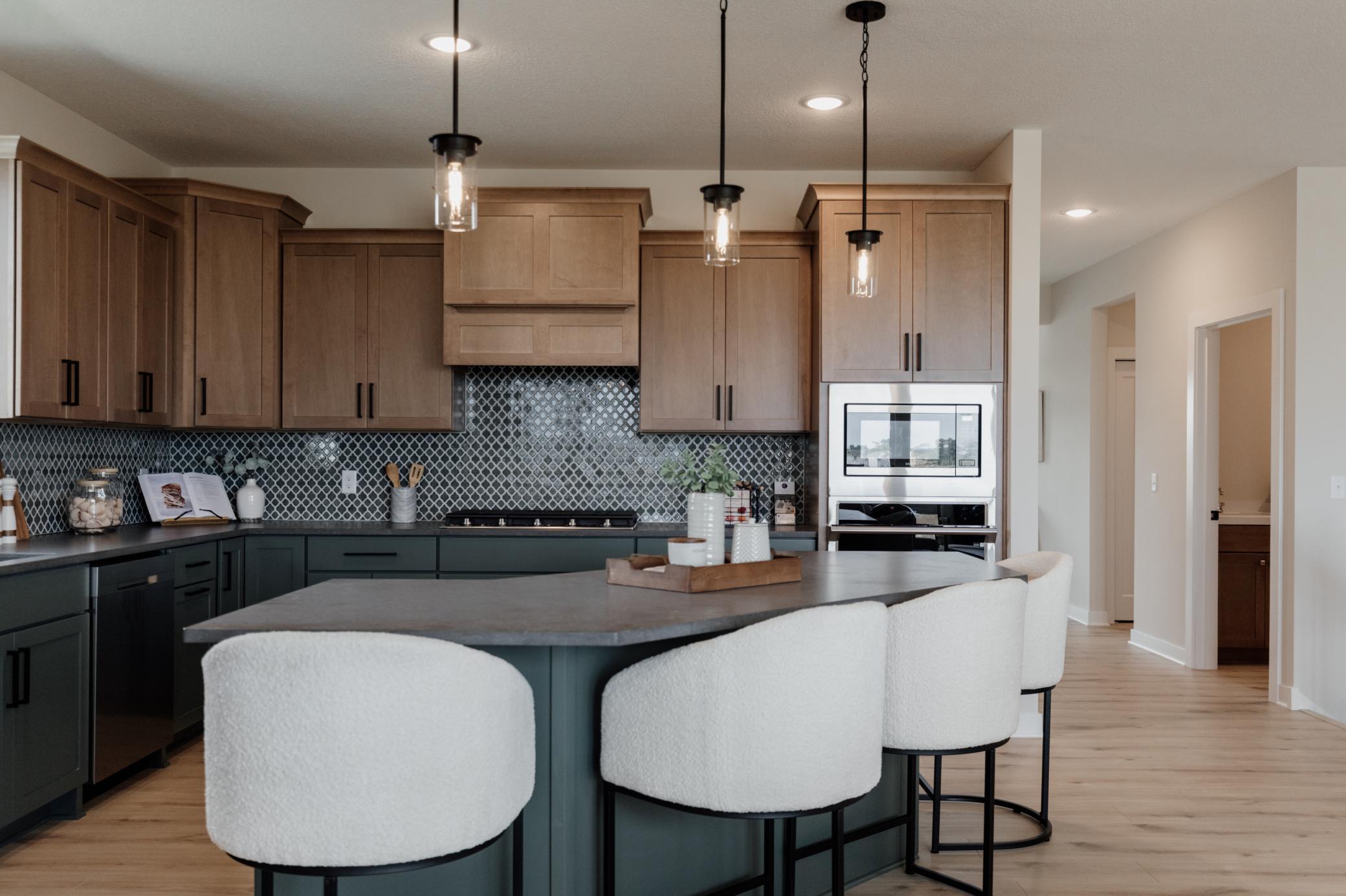 The gourmet kitchen. *Photo of similar home with the same layout.