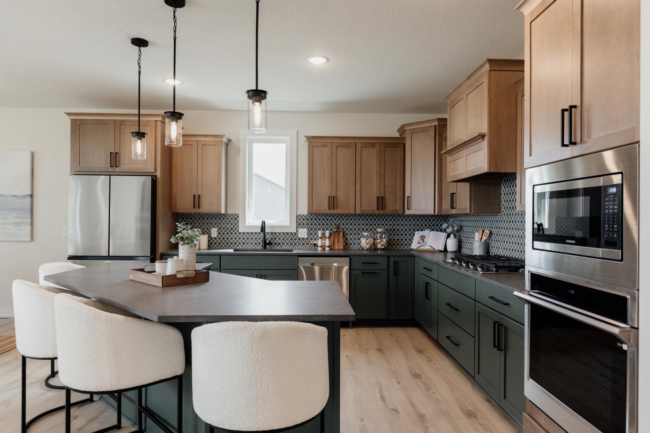 The gourmet kitchen. *Photo of similar home with the same layout.